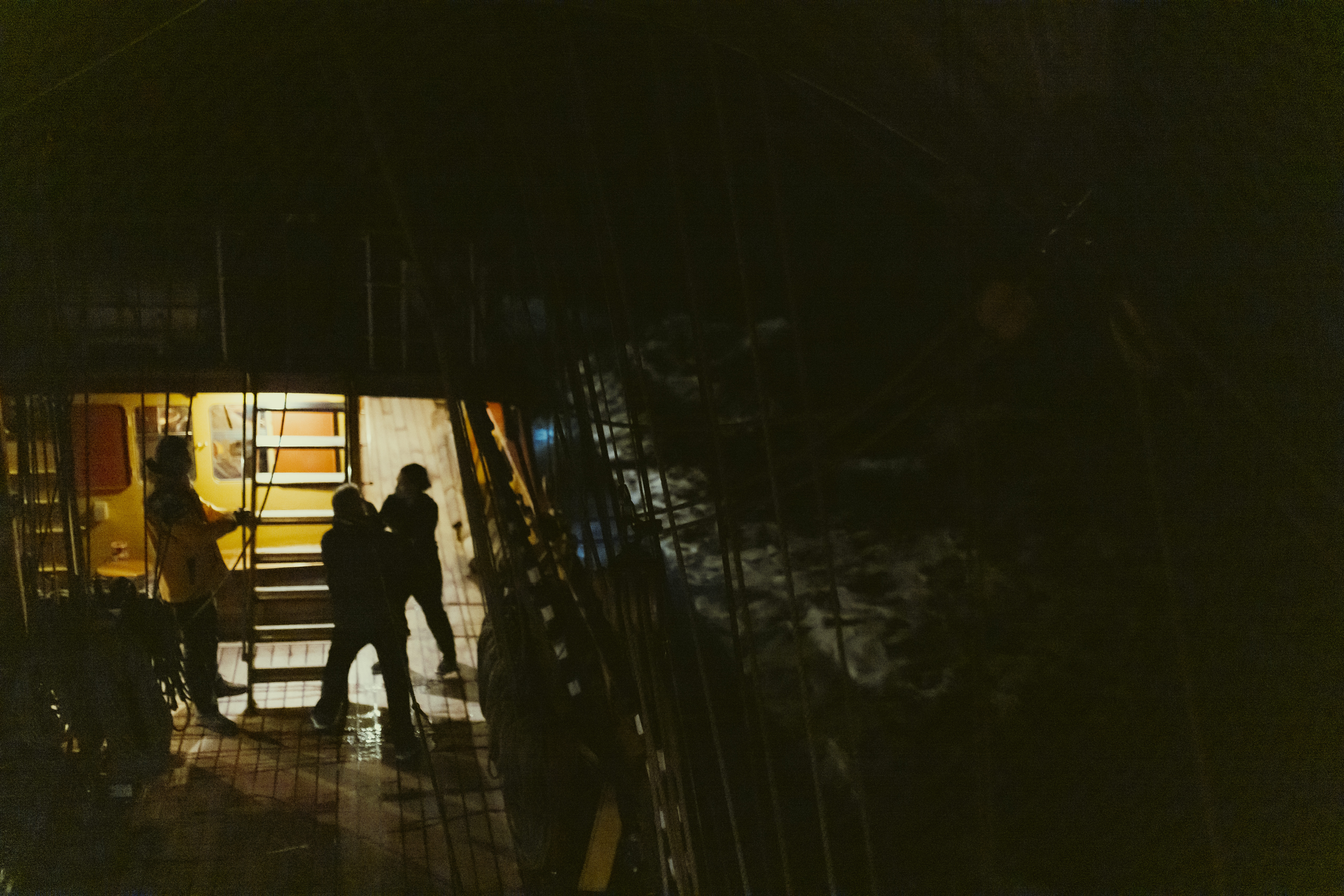 Night aboard Bark EUROPA — silhouettes in warm light